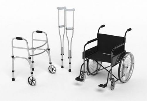 Black disability wheelchair, crutch and metallic walker isolated on white